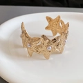 Detailed macro view of gold starfish bracelet with textured metal and white pearls - Starfish Pearl Inlay (25#)