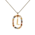 Macro detail of gold necklace with letter L pendant and multicolor cubic zirconia - L
