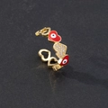 Detail of adjustable evil eye heart ring with red enamel and sparkling zircon pavé - Style 2-Red Heart Eye