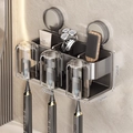 Gunmetal grey suction toothbrush holder with 3 cups and 3 slots for wall-mounted storage - Family of 3 · 3 Cups
