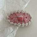 Close-up of handmade crochet strawberry cake hair clip with pink and cream wool details - Crochet-Pink Strawberry