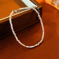 Elegant silver multi-faceted metal bead bracelet with lobster clasp on textured cloth - Silver - Crushed Silver Pearl Bracelet