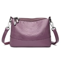 Elegant purple snake-embossed PU leather crossbody bag with adjustable straps on white background - Purple