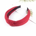 Red knitted cotton headband with knot design and comfortable inner fabric lining - Red