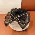 Elegant black tulle bow hair scrunchie with sparkling rhinestones on ceramic cup - Black