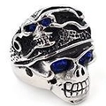 Close-up of gothic skull ring with blue gemstone eyes and vintage embossed details - 22104