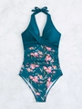 Detail of teal halter one-piece swimsuit with floral patterns on white marble background - S / Teal Blue with Floral Print