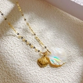 Golden sea shell necklace with iridescent mother of pearl and small metal pendant - Shell Style
