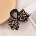 Elegant knit bow claw clip featuring a brown leopard print pattern on beige linen - Beige Leopard