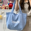 Borsa tote in tela azzurra con coulisse, scritta Wabibi e interno molto capiente - Blu