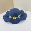 Detail of navy blue straw sun hat with embroidered sunflowers and wavy brim design - Navy Blue