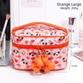 Large orange checkered makeup bag featuring a cute cartoon dog and bow charms - Orange Large