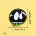 Macro shot of resin ghost charm showing dimensions 2.8x2.9cm for Halloween DIY crafts - Black Stitched Doll Head