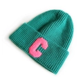 Green knit beanie hat featuring a pink towel-embroidered letter C decoration - Lake Blue