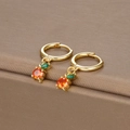 Close-up of golden fruit hoop earrings with orange and green zircon and S925 hallmark - Gold Orange