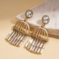 Detail view of vintage gold tassel earrings featuring crystal studs and woven metal frames - Gold / Gold