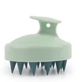 Close-up of green scalp massage brush with ergonomic handle and soft silicone bristles - Single Dual Green Scalp Massager
