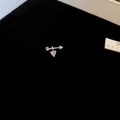 Macro shot of a silver arrow stud earring featuring a delicate pink heart-shaped zircon - Silver Cupid's Arrow Heart Style