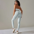 Rückansicht der hellblauen nahtlosen Yogahose und des gerippten Sport-BH-Sets - S / Hellgrau