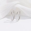 Detailed macro view of S925 sterling silver bamboo knot U-shaped earrings with hallmark - Style B: Smooth Surface / Silver