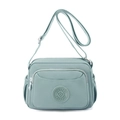 Waterproof nylon crossbody bag in light blue with adjustable strap and multiple pockets - Aqua