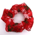 Detailed view of red mesh scrunchie with white and green Christmas snowflake pattern - Red with Snowflake
