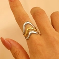 Detail of multi-layered wavy ring in silver and 18K gold contrast finish on a hand - 18K Gold Three-Layer Gold-Silver (8284)