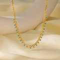 Golden chain necklace with turquoise blue beads and small gold ball pendants detail - Blue and Gold Bead Necklace (H1006) / Gold