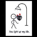 Heart shaped dark gemstone on You Light Up My Life card with creative illustration - Larvikite