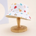 Close-up of white cotton children's bucket hat with colorful fruit print on wooden stand - Kids One Size / White (Cartoon Fruit)