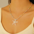 Colorful Y2K beaded necklace featuring a glossy white starfish pendant on a model - White Starfish (KDZ-1027)