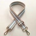 Detail of adjustable beige bag strap featuring silver glitter stripes and gold metal hooks - Light Khaki