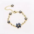 Elegant gold flower bracelet with deep blue pear-cut gemstones and leaf details - Gold-Royal Blue