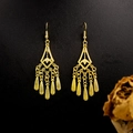 Macro detail of bohemian gold bell tassel earrings with intricate hollow leaf patterns - E5765-15 Vintage Filigree Peacock Enamel