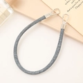 Close-up of a grey woven PU leather hand strap with silver metal buckles on a display tray - Navy Blue (K3864)