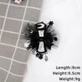 Detail shot of black graduation bow hair clip with mesh veil, stars, and moon sequins - Silver Graduation Certificate