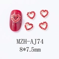 Macro detail of red hollow heart nail art charms with gold base on glossy nails - Hollow Red Rhinestone Heart(AJ74)