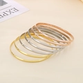 Detailed stack of 3.6mm polished stainless steel bangles in gold, silver, and rose gold - Inner Diameter 68mm / 7-Pack Set / Mixed 3-Color