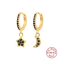 Detailed macro view of S925 sterling silver stamp on star and moon hoop earrings - Gold - Black Zirconia
