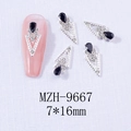 Macro shot of 7x16mm alloy nail art charms with black teardrop stones and silver frames - Silver Base Black (9667)