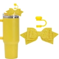 Detail view of yellow glitter bow straw topper and silicone cap for tumbler set - Yellow