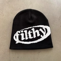 Detailed knit texture of a black streetwear beanie with white 'filthy' jacquard lettering - One Size / Black