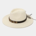 Detail of woven Panama hat with shell and bead band showing boho beach style - One Size / Beige