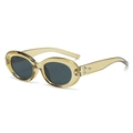 Detail shot of oval transparent amber sunglasses with star metallic studs on temples - Olive Green Frame Black Grey Lens