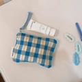 Detail shot of the blue and yellow checkered fabric mini coin purse with small red flowers - Blue and White Small Grid Floral