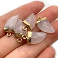 Pink quartz shark tooth pendants with gold-plated edges held in hand for size - 10x20mm / Rose Quartz