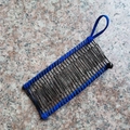 Banana hair clip with blue elastic band and black metal combs on marble background - 30 Teeth / Royal Blue