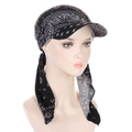 Detail of black paisley print turban hat with brim and adjustable straps on mannequin head - Black Paisley