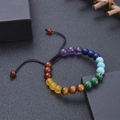Chakra natural stone 8mm bead bracelet with black woven cord on a dark display - Double Layer Chakra Stones
