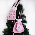 Pink plush Christmas drawstring gift bags featuring Santa and Snowman applique - Random Pink Bag